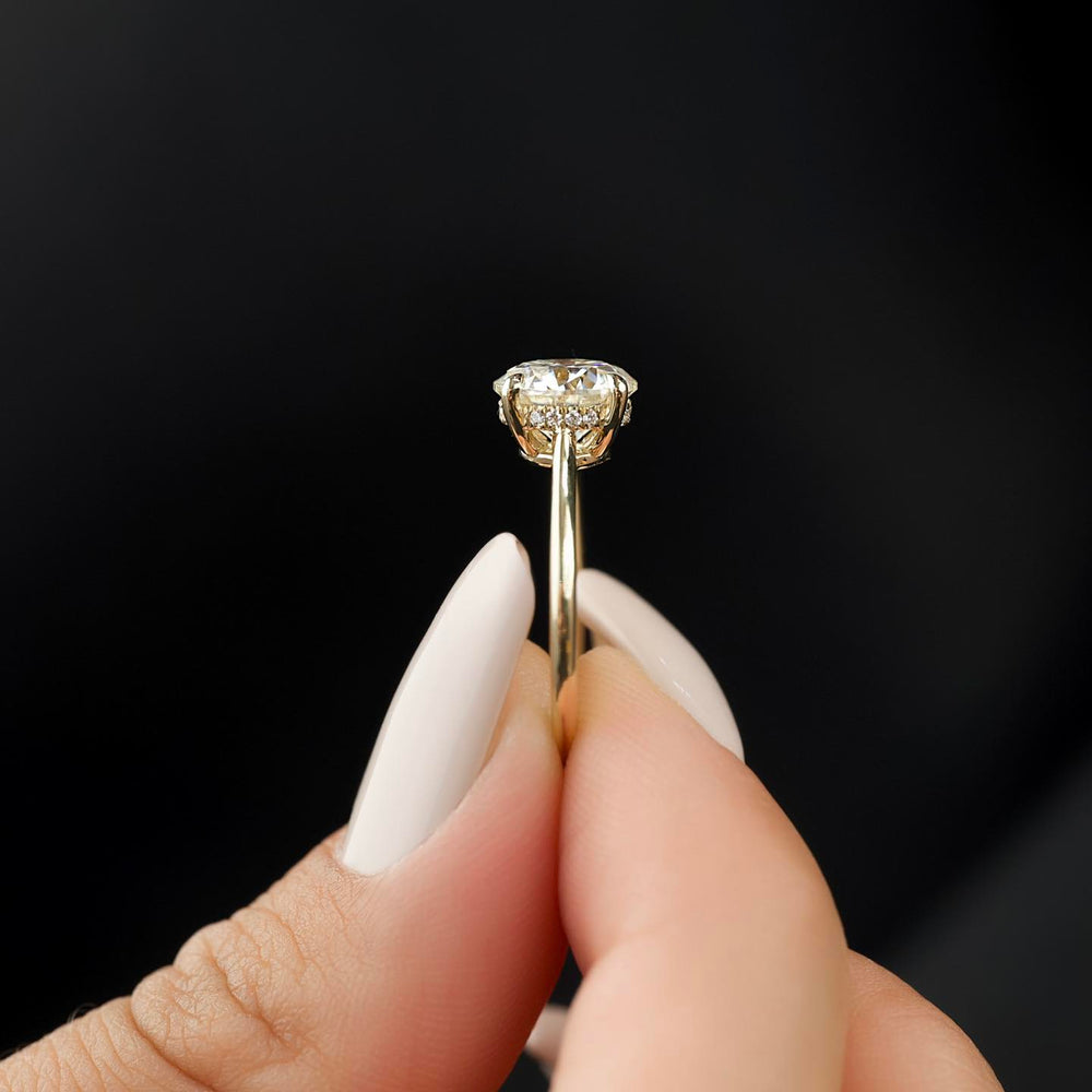 Round hidden halo diamond ring presented in signature gift packaging