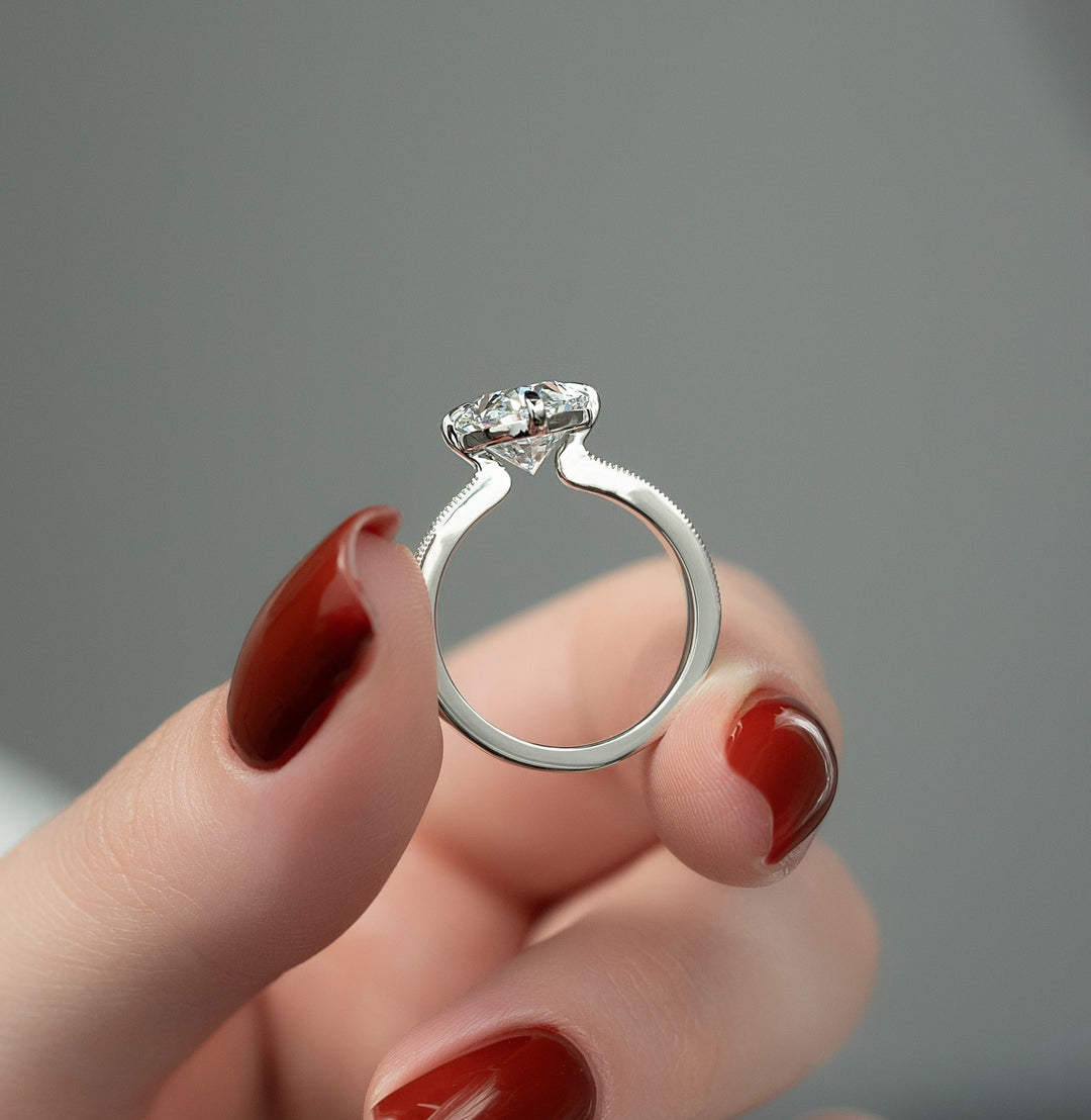 Certified oval cut diamond featured in hidden halo engagement ring