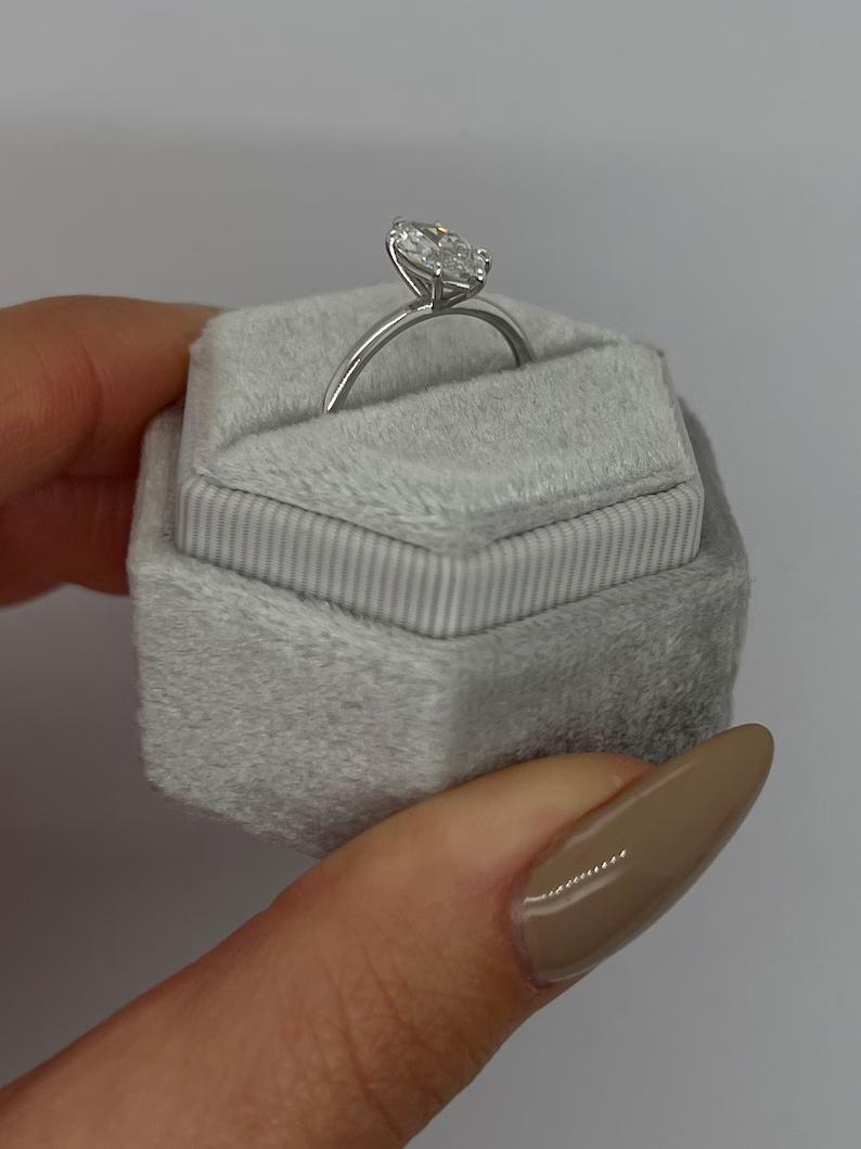 Marquise solitaire engagement ring close-up highlighting diamond sparkle