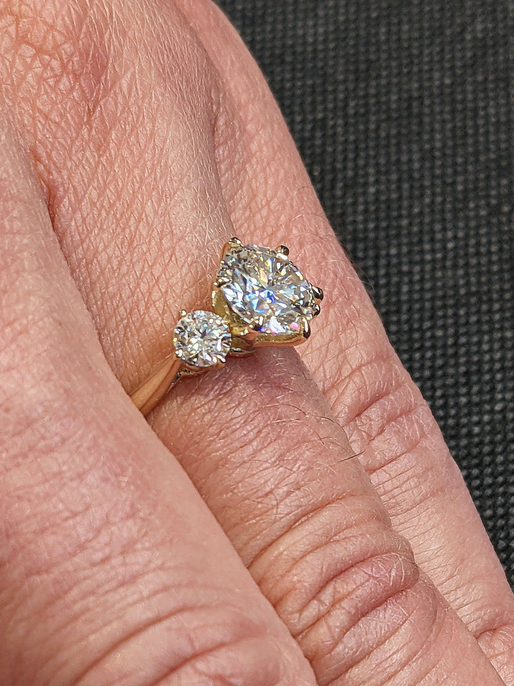 Round three stone ring set with an IGI graded diamond