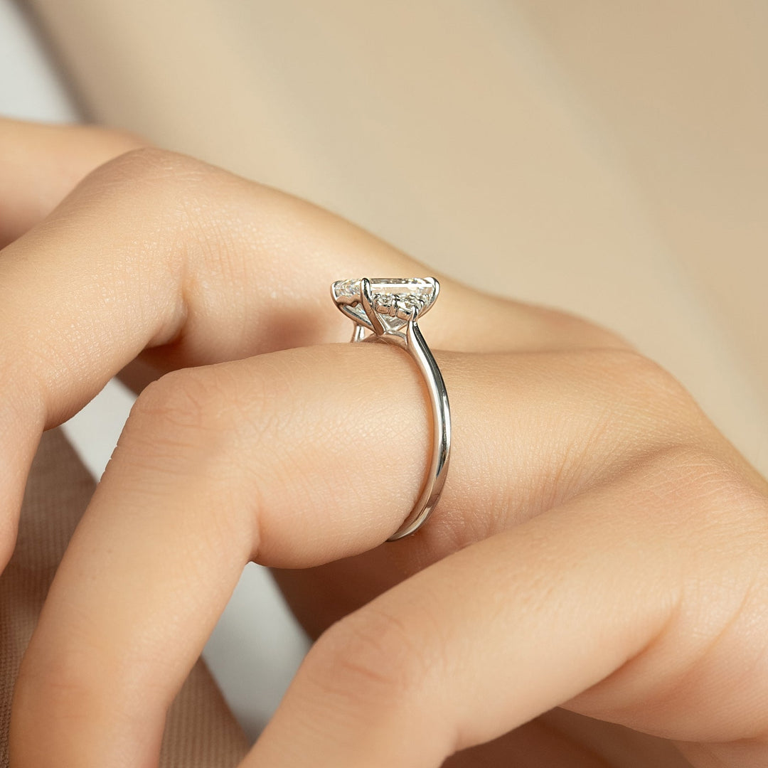 Emerald cut cluster engagement ring with IGI certified center diamond