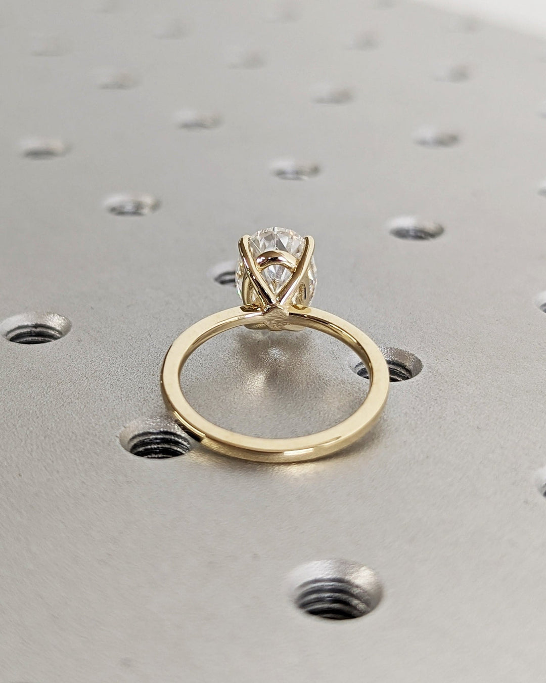 Oval cut diamond ring worn on hand