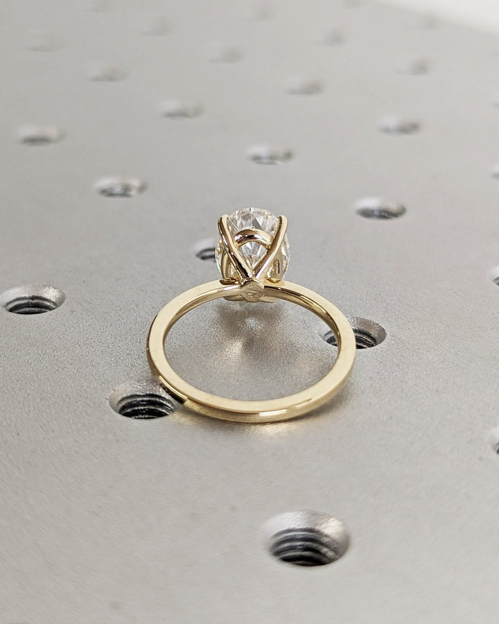 Oval cut diamond ring worn on hand