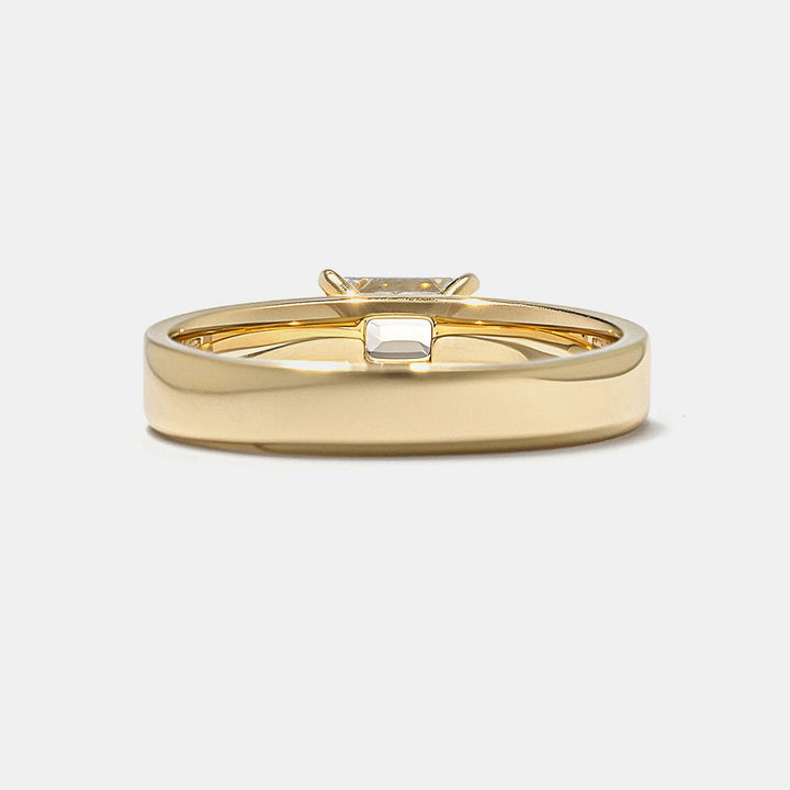 Fine craftsmanship detail on emerald east west engagement ring