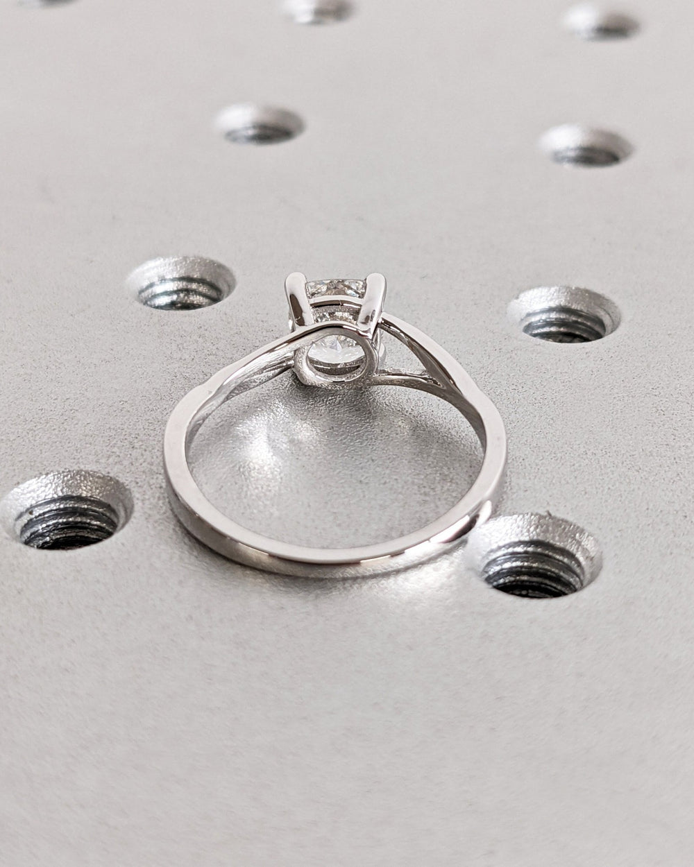Cushion split shank lab grown diamond ring fitted on finger