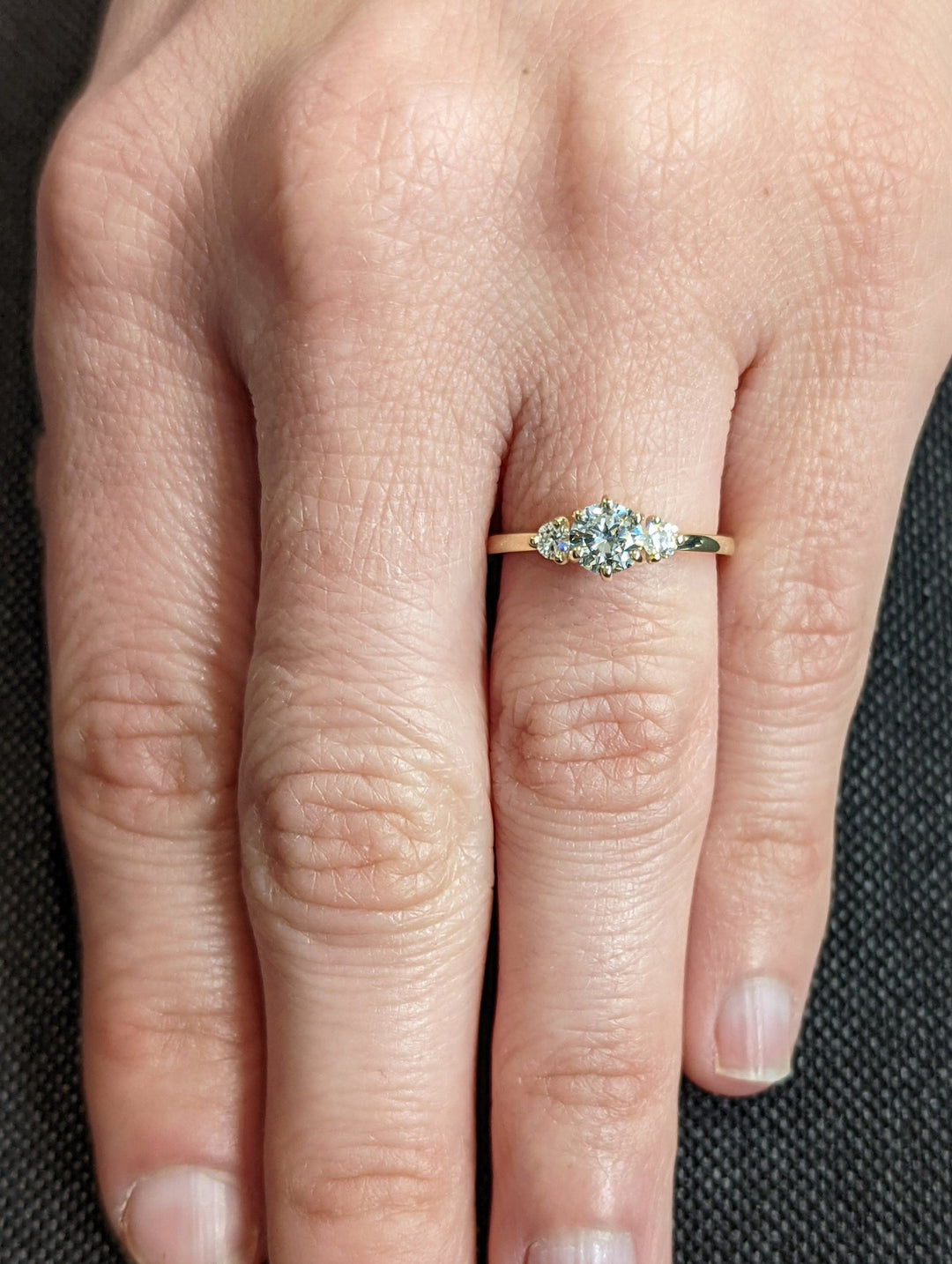 Close-up of round cut center diamond in solitaire engagement ring