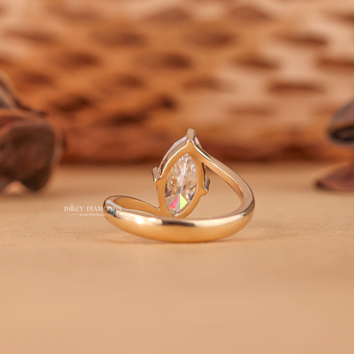 Marquise solitaire engagement ring close-up highlighting diamond sparkle