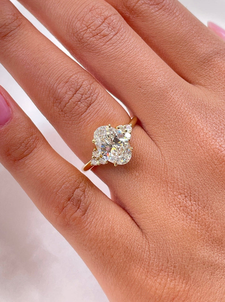 Profile view of oval cut cluster engagement ring band