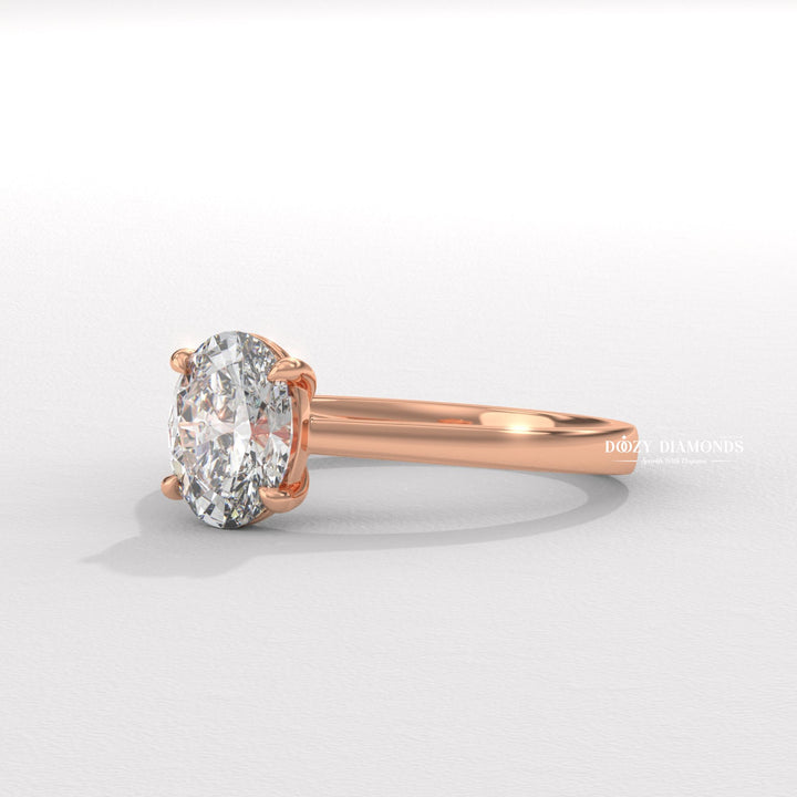 Close-up of oval cut center diamond in solitaire engagement ring