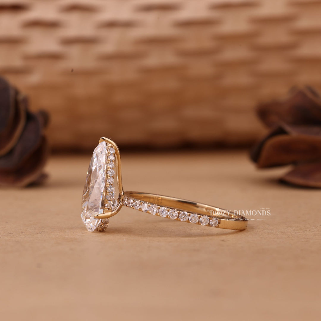 Side angle of pear hidden halo diamond engagement ring
