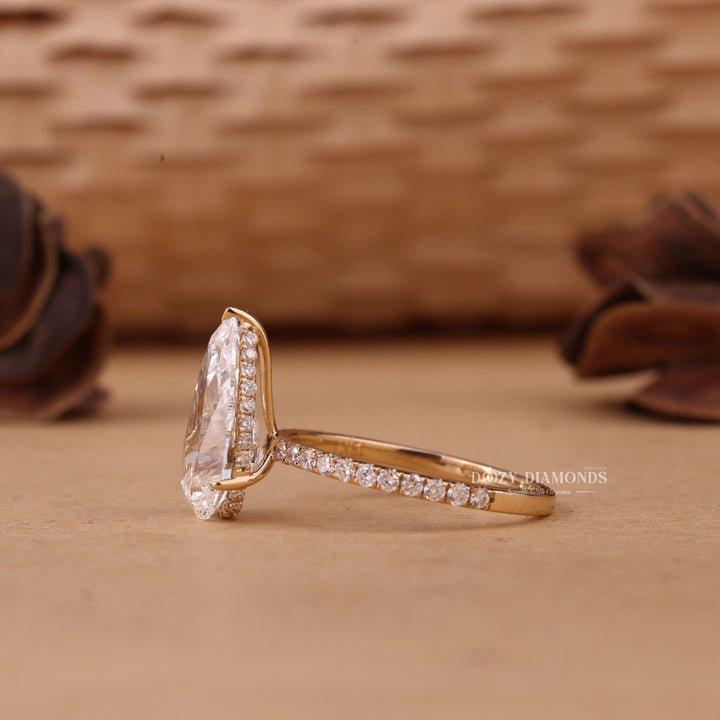 Side angle of pear hidden halo diamond engagement ring
