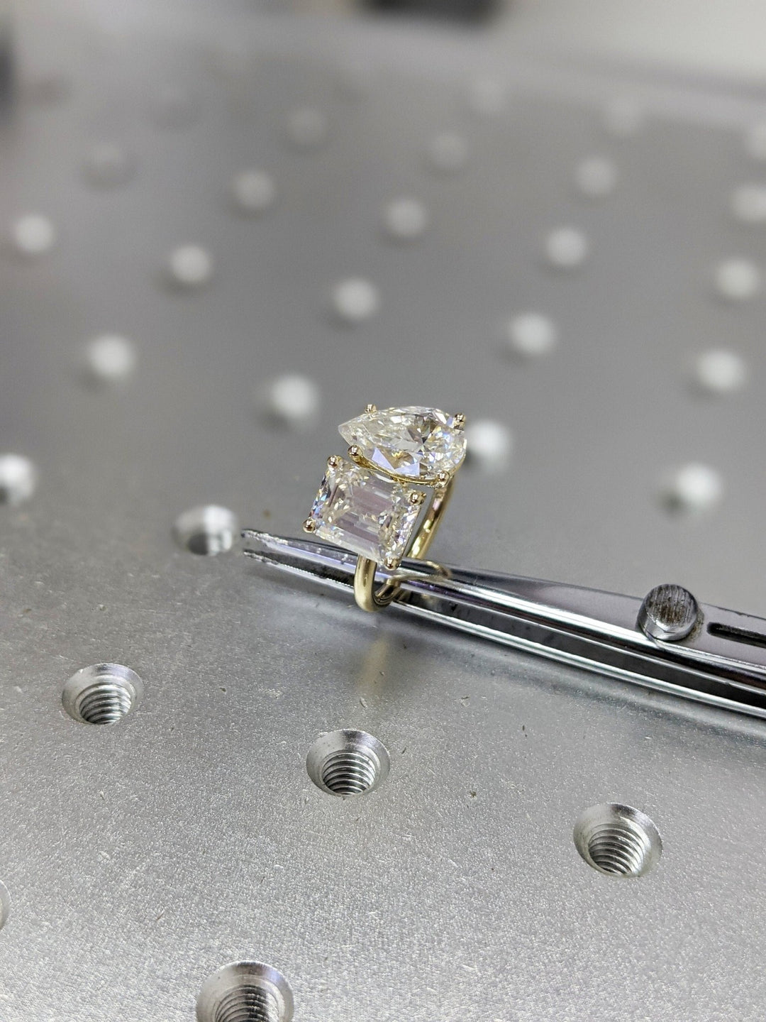 Pear cut diamond ring worn on hand