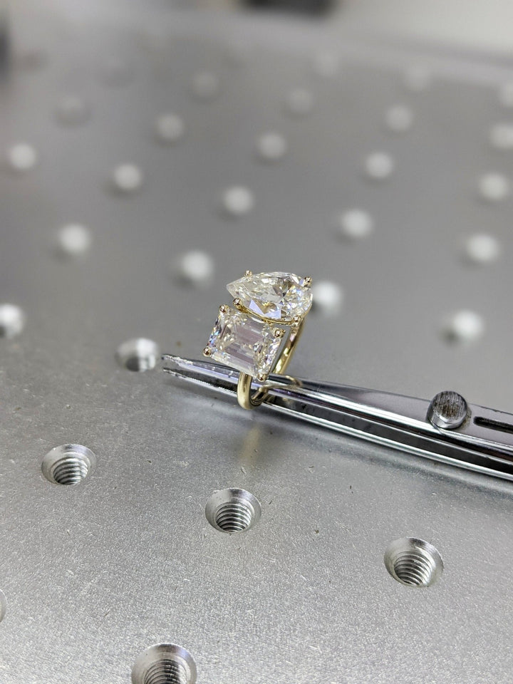 Pear cut diamond ring worn on hand