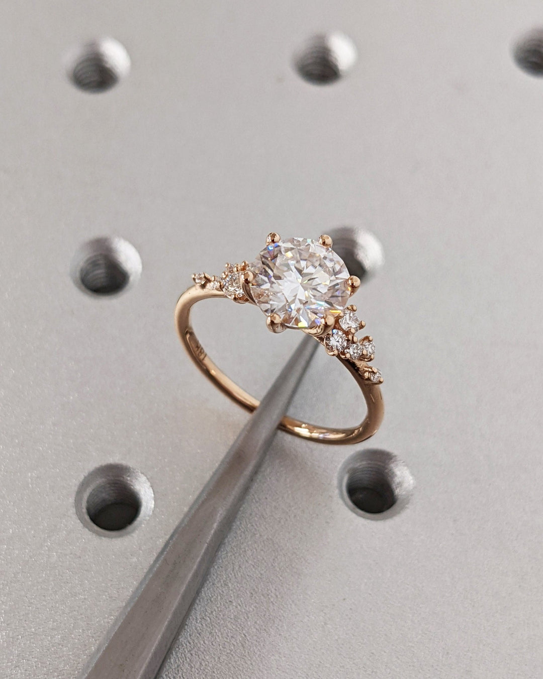 Lifestyle shot of round cluster diamond ring on hand