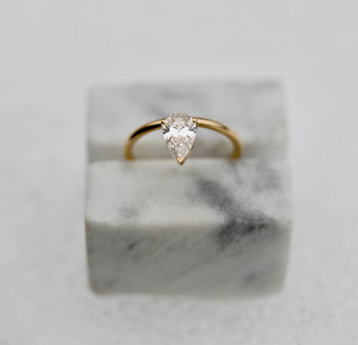 Fine craftsmanship detail on pear solitaire engagement ring