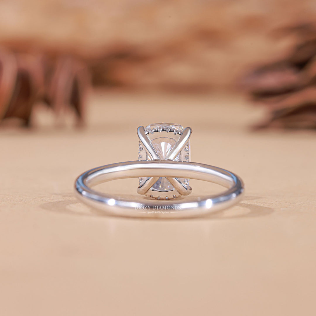Cushion hidden halo lab grown diamond ring fitted on finger