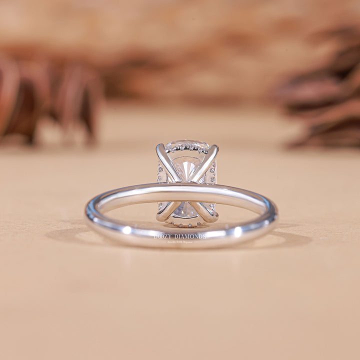 Cushion hidden halo lab grown diamond ring fitted on finger