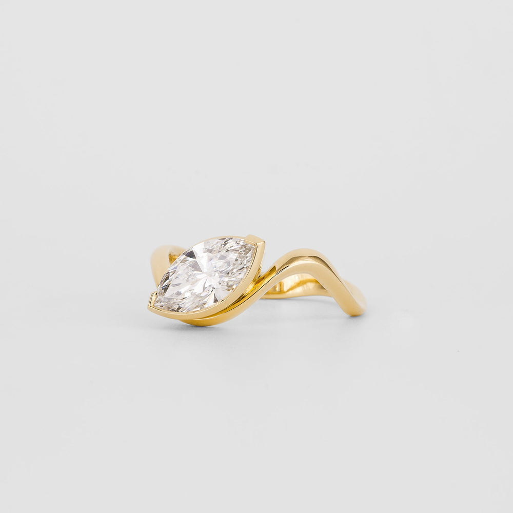 Unboxing view of marquise cut solitaire diamond engagement ring