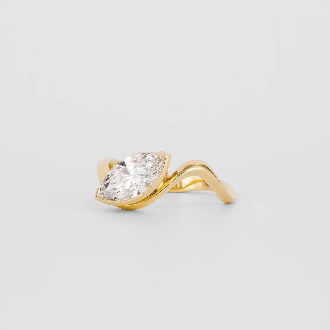 Unboxing view of marquise cut solitaire diamond engagement ring