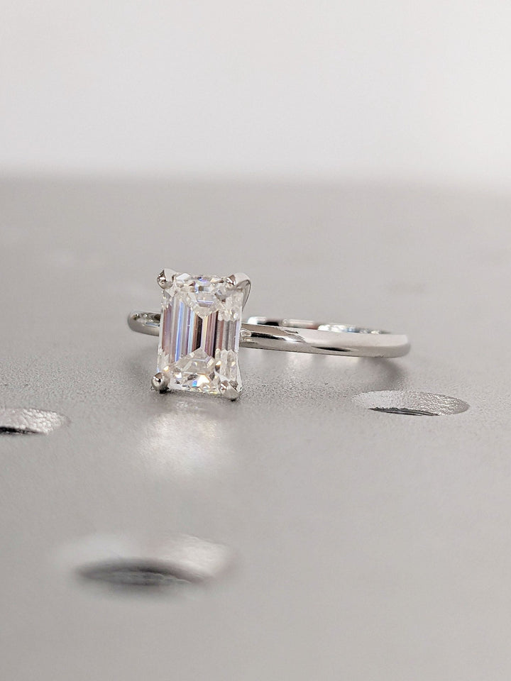 Macro shot of emerald cut diamond facets in solitaire ring setting