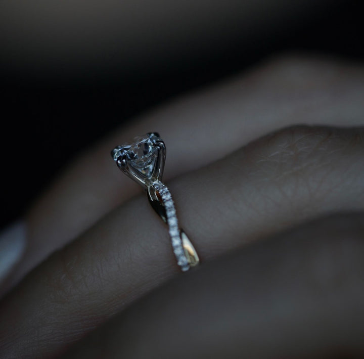 Round cut engagement ring side view showing band detail