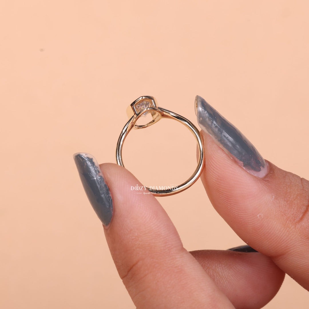 Marquise bezel engagement ring finished in polished solid gold