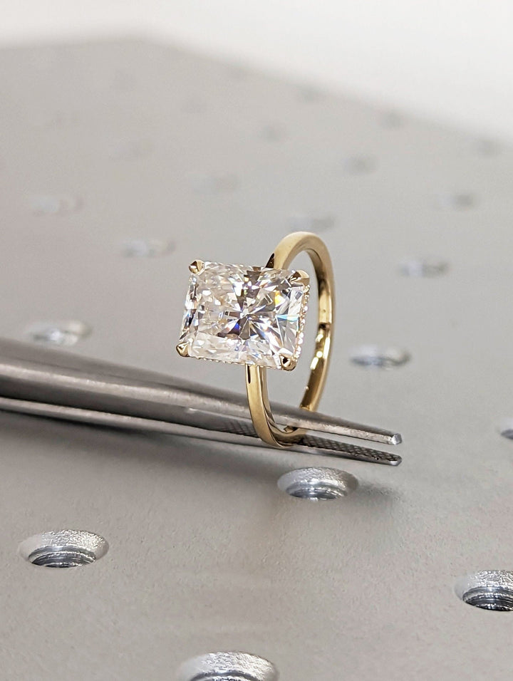 Fine craftsmanship detail on radiant hidden halo engagement ring