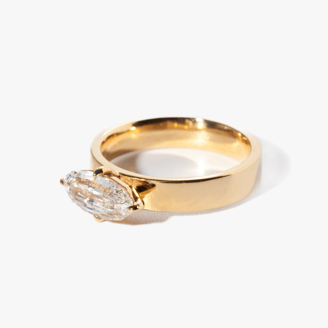 Detailed close-up of oval solitaire diamond engagement ring