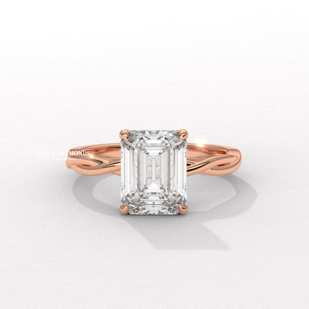 Unboxing view of emerald cut solitaire diamond engagement ring