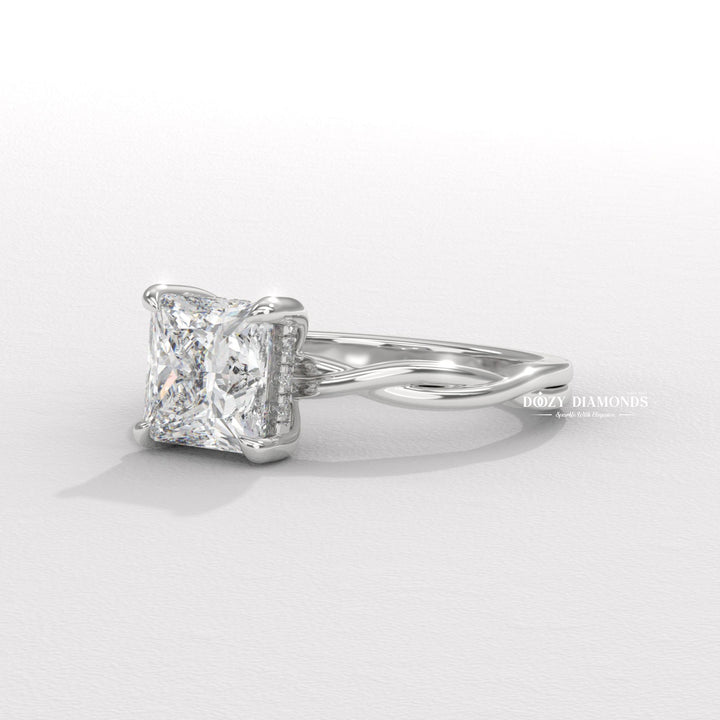 Princess solitaire engagement ring shown on hand for true-to-life sizing