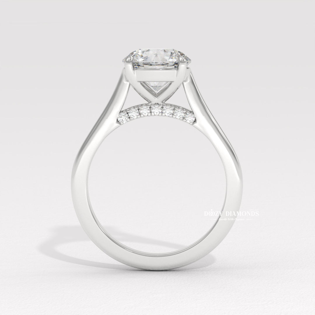 Round cut solitaire engagement ring shown in real-life wear