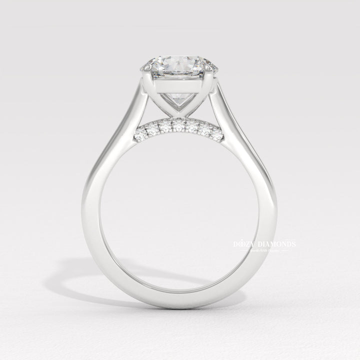 Round cut solitaire engagement ring shown in real-life wear