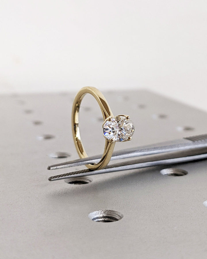 Macro shot of oval cut diamond facets in solitaire ring setting