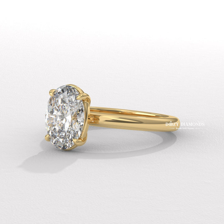 Oval solitaire lab grown diamond ring fitted on finger