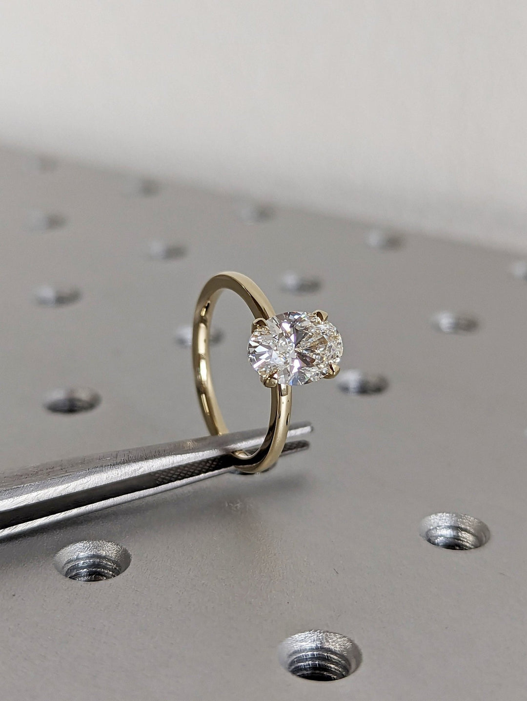 IGI certified oval cut diamond in solitaire engagement ring setting