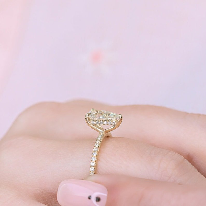 Pear cut engagement ring side view showing band detail