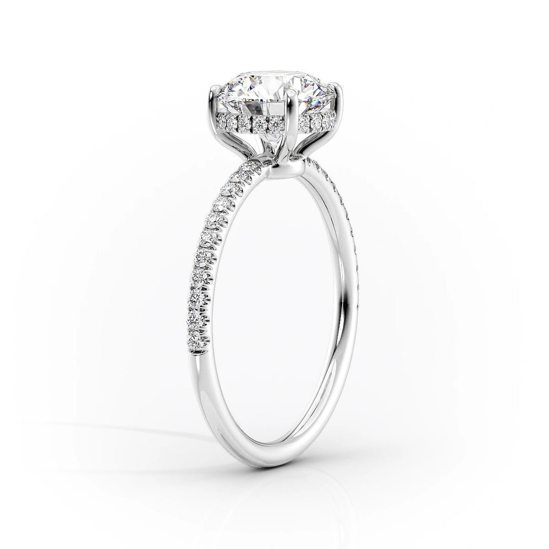 Oval hidden halo engagement ring viewed from the side