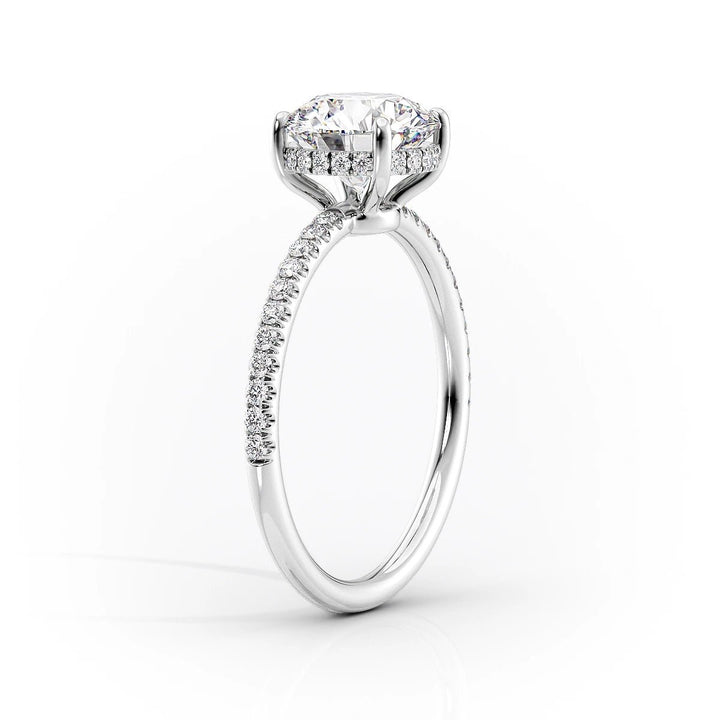 Oval hidden halo engagement ring viewed from the side