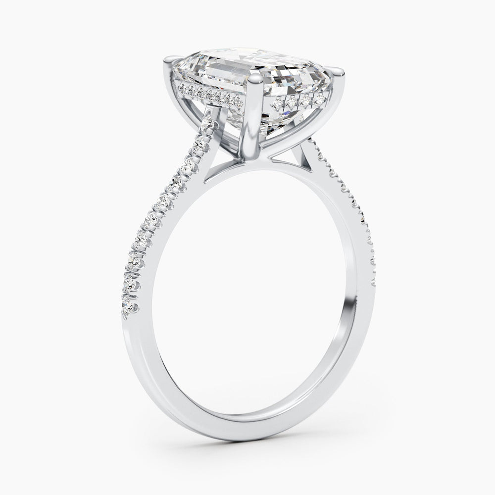 Fine craftsmanship detail on emerald pave engagement ring