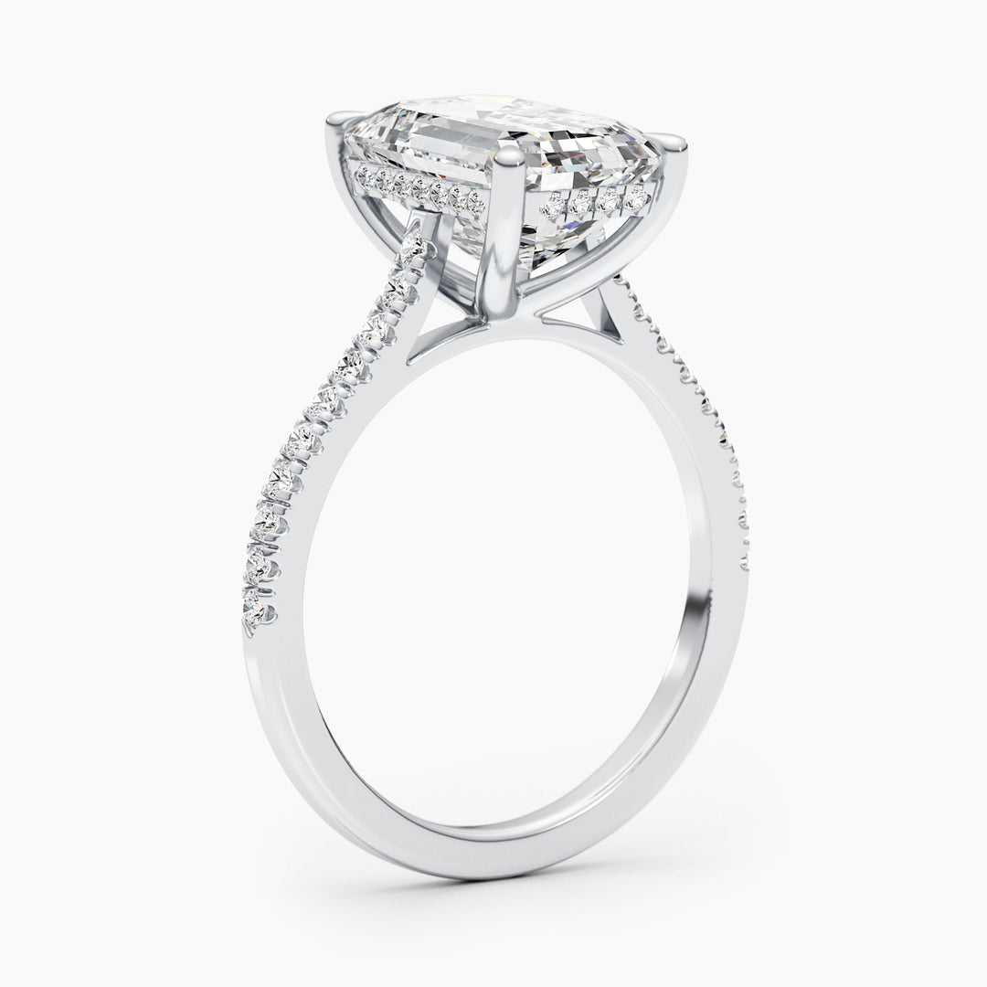 Fine craftsmanship detail on emerald pave engagement ring