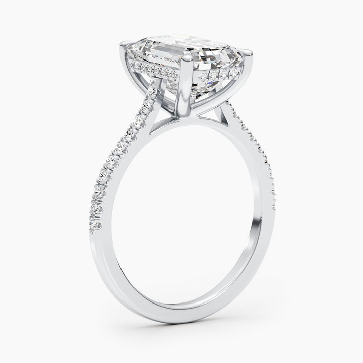 Fine craftsmanship detail on emerald pave engagement ring