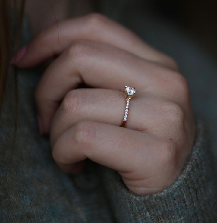 Round solitaire engagement ring offered in gold and platinum