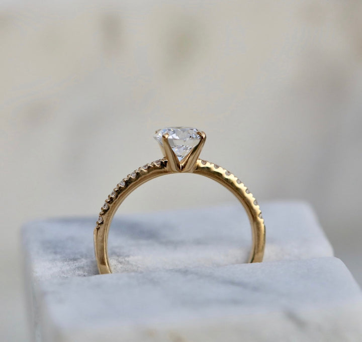 Close-up of round cut center diamond in solitaire engagement ring