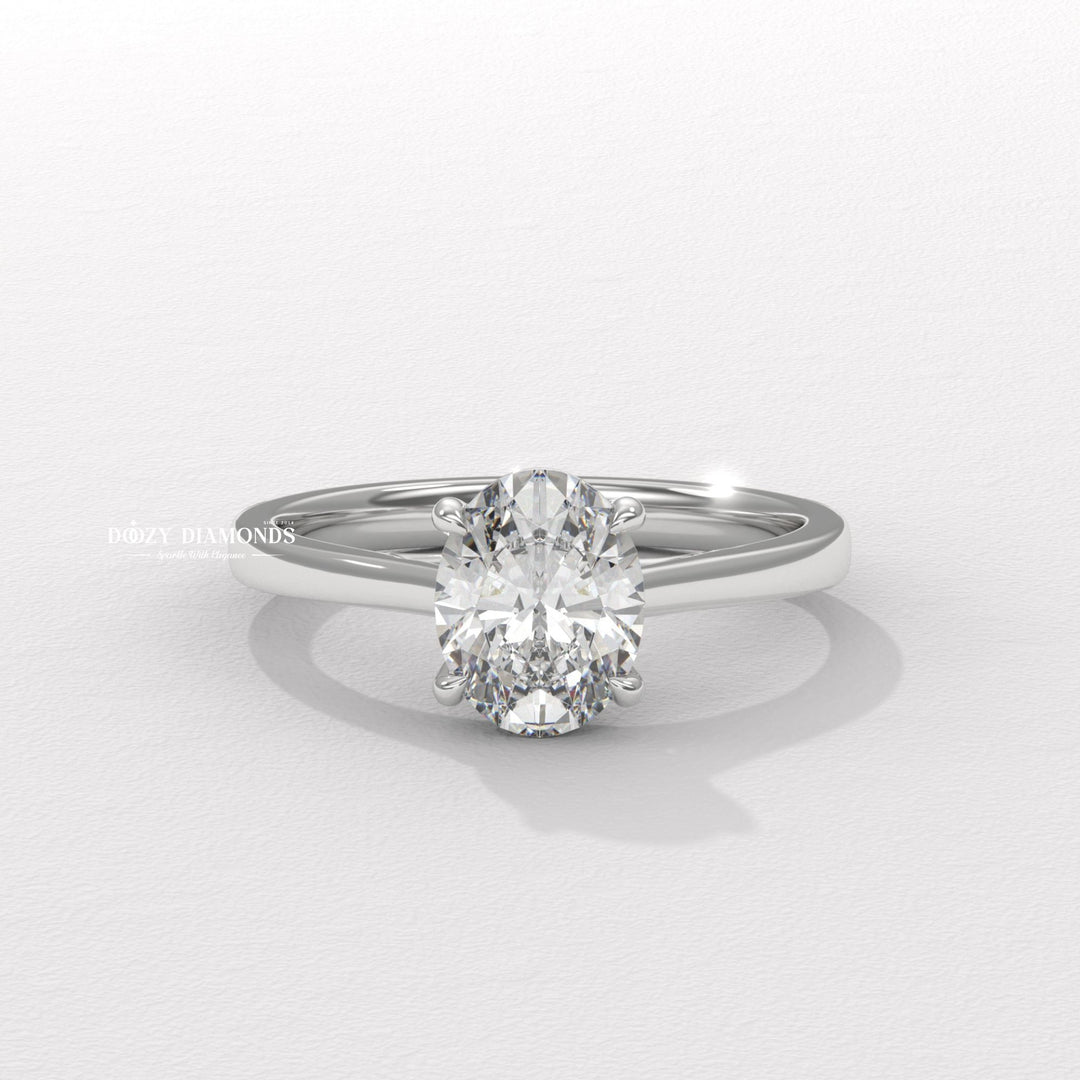 Oval solitaire engagement ring photographed in natural light