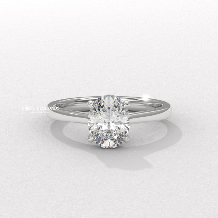 Oval solitaire engagement ring photographed in natural light