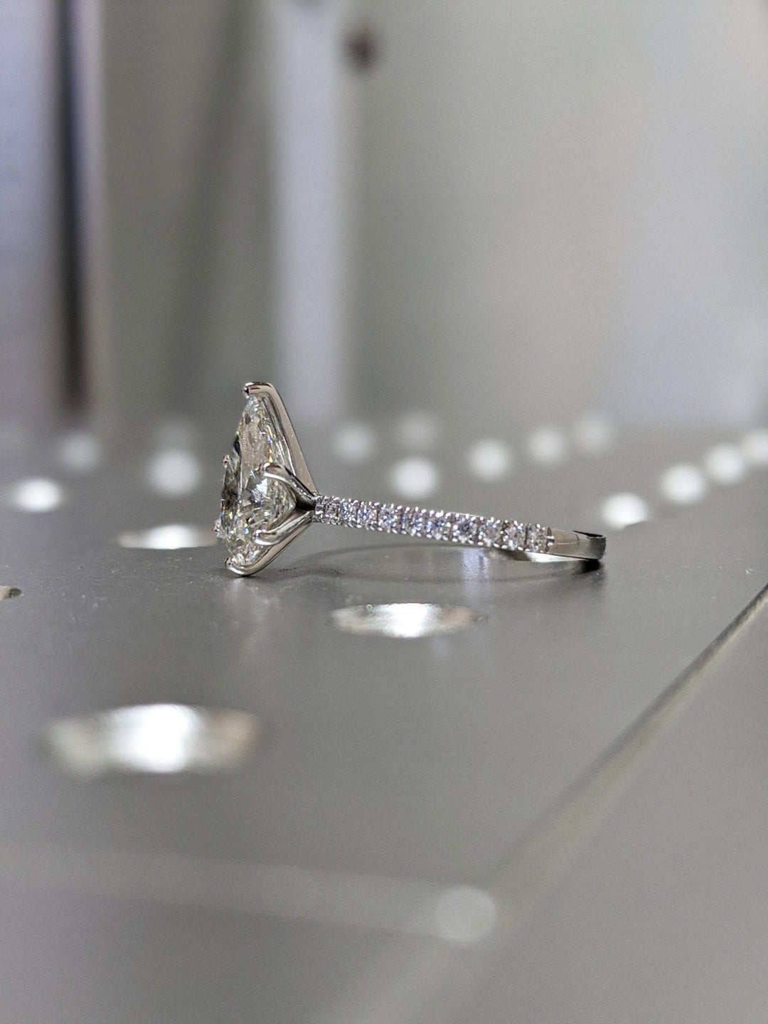 Pear pave lab grown diamond ring fitted on finger