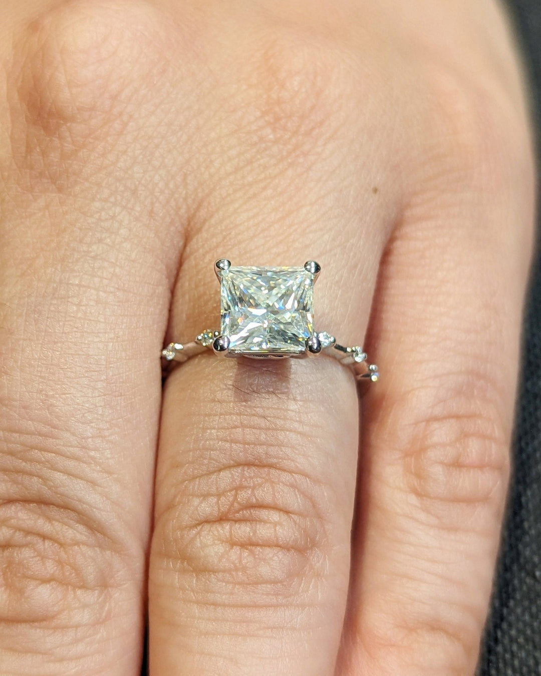 Lifestyle shot of princess pave diamond ring on hand