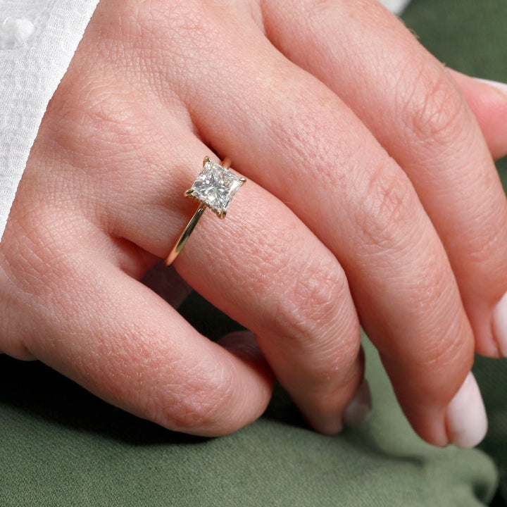 Princess hidden halo diamond engagement ring available in multiple metals