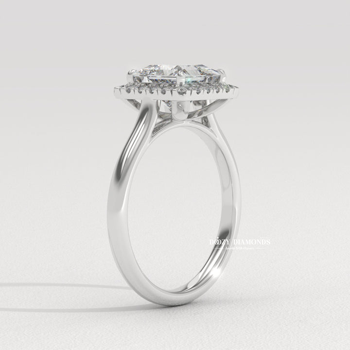 Princess solitaire diamond ring displayed on jewelry stand