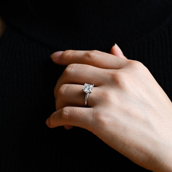 Princess solitaire engagement ring close-up highlighting diamond sparkle